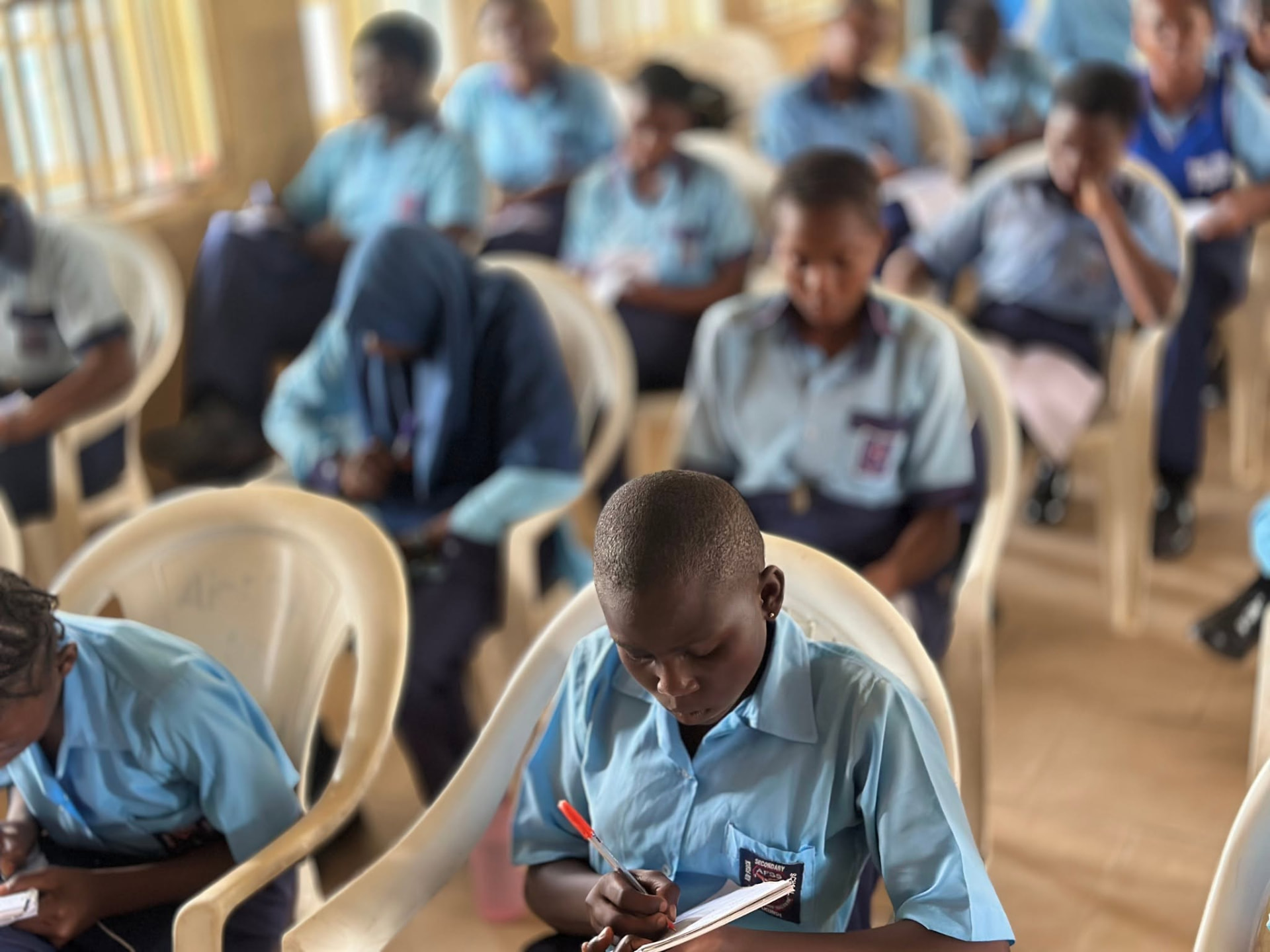 Students taking notes during a lesson
