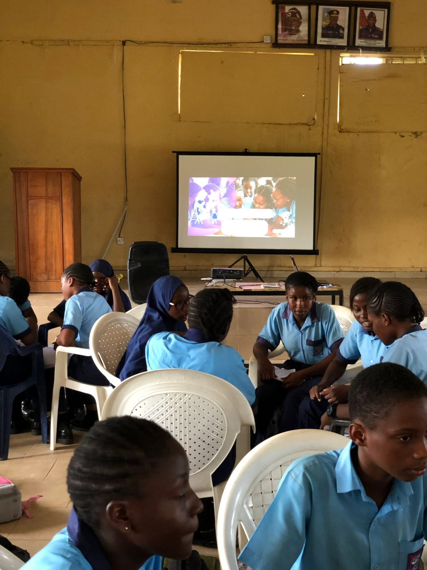 Students seated in a circle for a breakout session